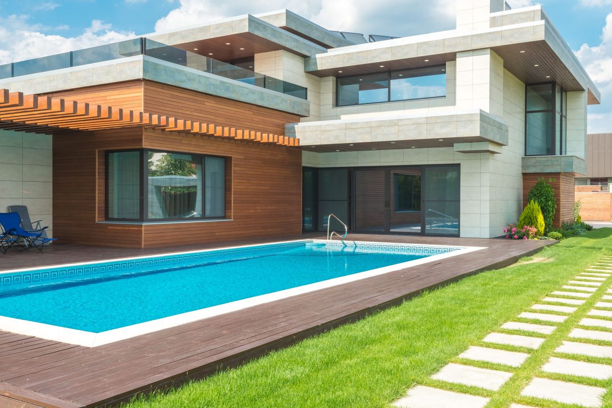 Modern residential backyard pool with a wood deck - Bonita Springs, FL pool resurfacing service area