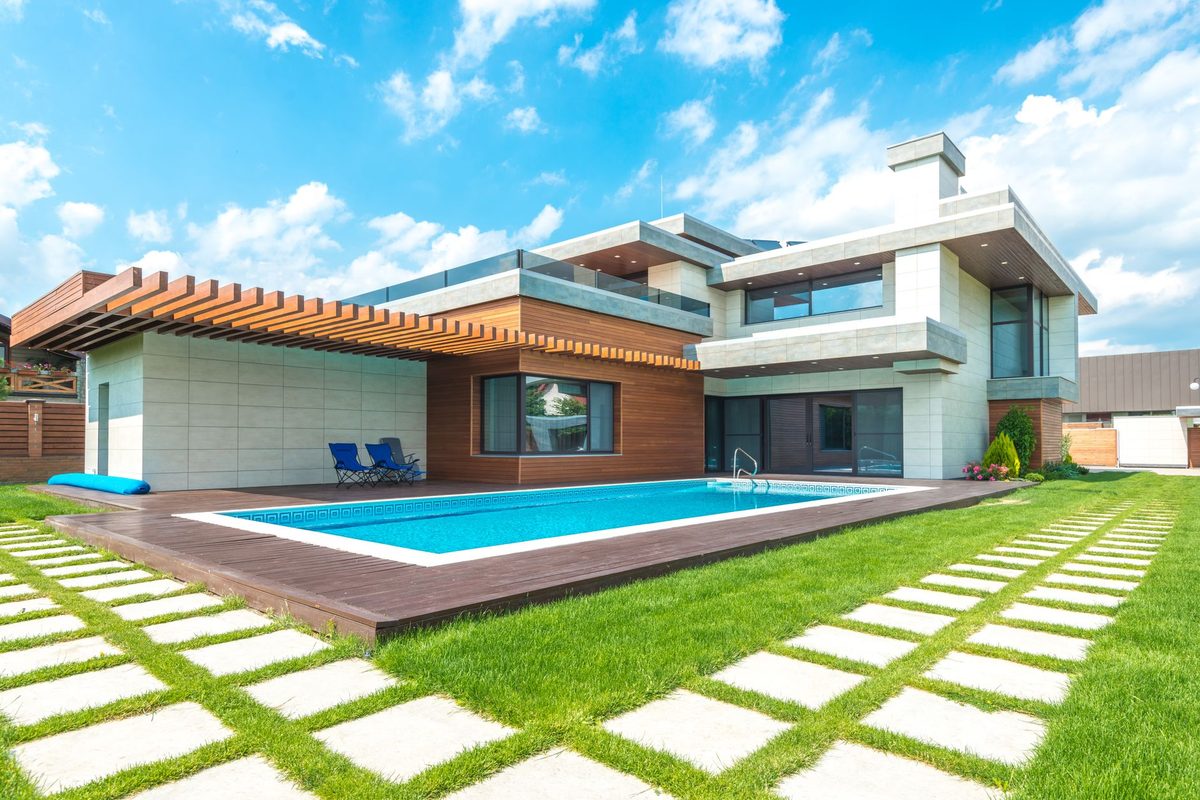 Residential backyard swimming pool and lawn on a sunny day - Lehigh Acres, FL pool resurfacing service area